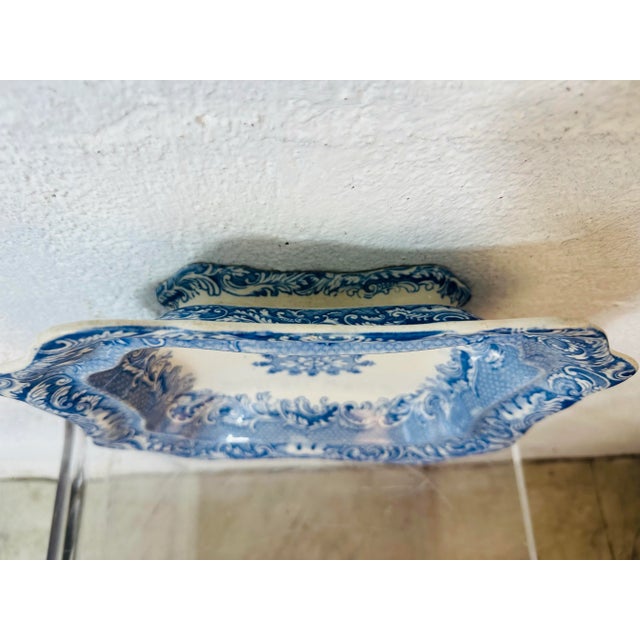 This vintage ceramic bowl is a striking example of 19th-century transferware, likely English in origin. Here’s a detailed...