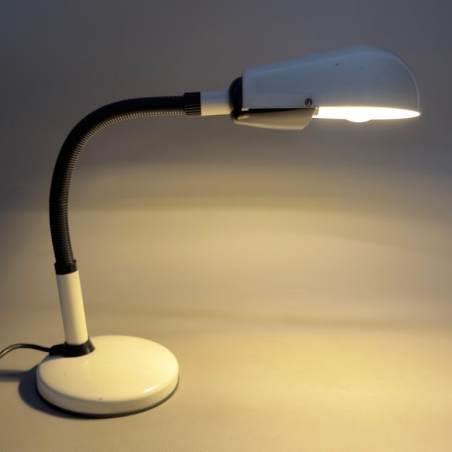An icon of pure functional design to illuminate your spaces with style and efficiency. This rare adjustable desk lamp is a...