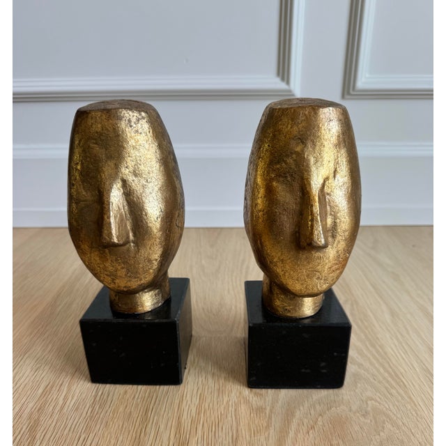 A striking pair of Villa & House Alberto Statues, thoughtfully designed to function beautifully as sculptural bookends...
