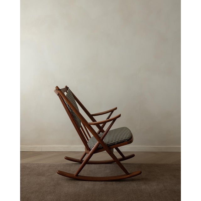 A beautifully sculptural vintage rocking chair by frank reenskaug for bramin, made in denmark and best known as model 182....