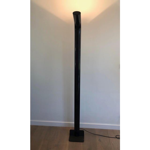 This designer floor lamp is made of black lacquered metal and is a halogen lamp. This is an Italian work. Circa 1970