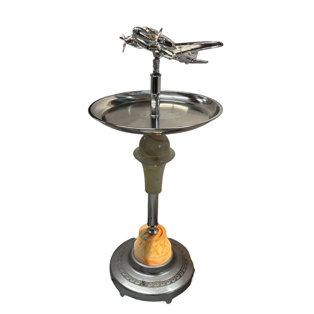 Art Deco chrome round chrome top side drinks table featuring a light-up art glass center with an additional light-up art...