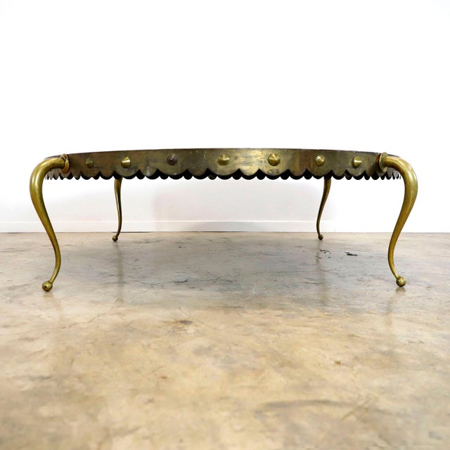 Circa 1960. We offer this cocktail table designed by Arturo Pani, the table are made in solid bronze whit spectacular legs...