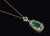 Natural emerald and diamond pendant crafted in solid 18K gold, featuring an approximately 3-carat pear-shaped center...