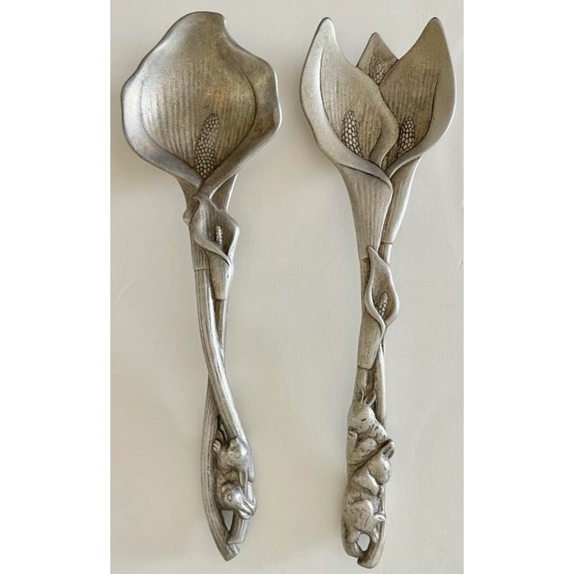 Romantic aluminum salad servers set by Arthur Court. Both are signed, dated 1991 and made in Taiwan. Set features calla...