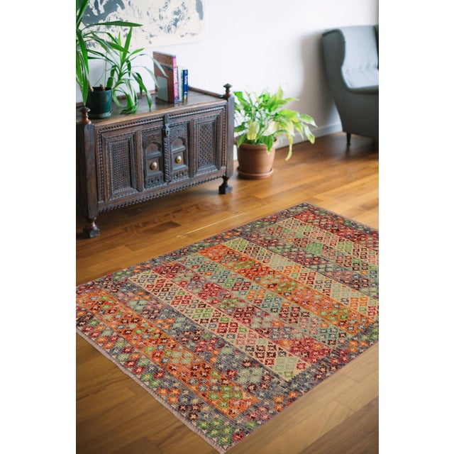 This stunning hand-knotted Afghan Balouchi rug is a captivating addition to any decor. Crafted by skilled artisans, it...