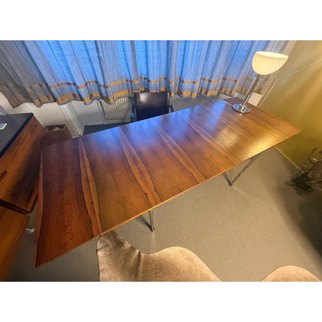 "Alain Richard dining table for TV unit 1958" Alain Richard dining table in rosewood veneer, chrome base, two extensions...