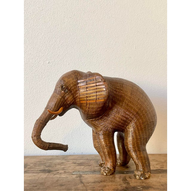 This charming vintage elephant figurine is a fine example of the intricate "Shanghai weave" technique, a hallmark of mid-...