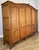 An impressive Vintage French Louis wardrobe crafted in oak , offering generous storage within an elegant five-door design....