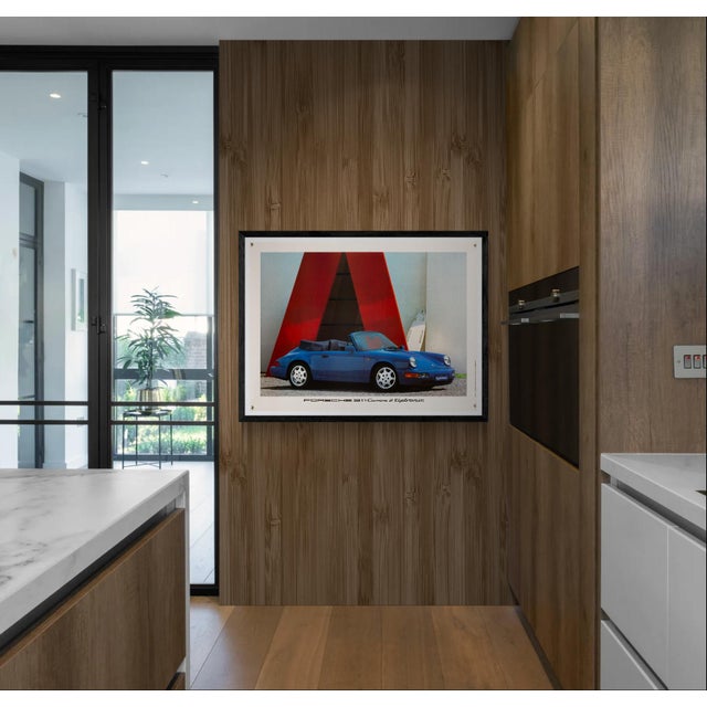 The Piece An original 1990 promotional poster for the Porsche 911 Carrera 2 Tiptronic, printed in Germany. This piece...