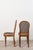 This elegant set of six French Louis XVI-style dining chairs (c. 1920) features hand-caned seats and rounded backs...