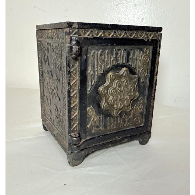 Up for sale is a wonderful antique 19th century cast Iron Security Safe Deposit still bank with a very unusual...