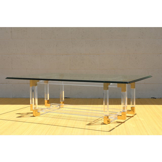Spectacular vintage acrylic and brass coffee table designed by Charles Hollis Jones. Originally from the 1970’s. This...