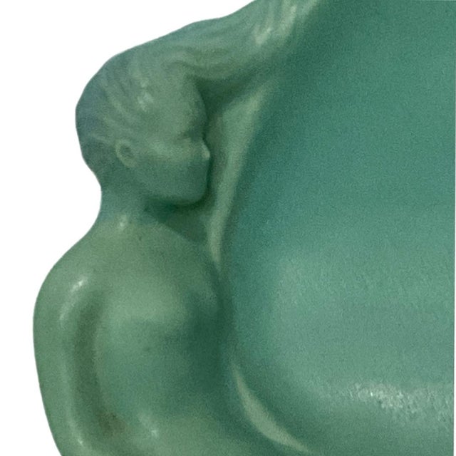 Vintage Van Briggle dish with a sleek, flowing design. The lovely mermaid sits at the edge with her tail flourishing...