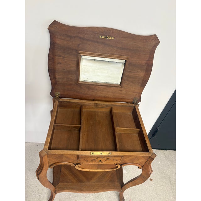 This French Napolean III work table, dating to the mid-19th Century, is a versatile and highly decorative antique that...