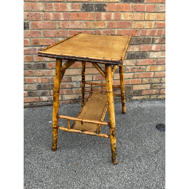 This is a beautiful 19th century English bamboo side table with small stretcher shelf! Tables like these make excellent...