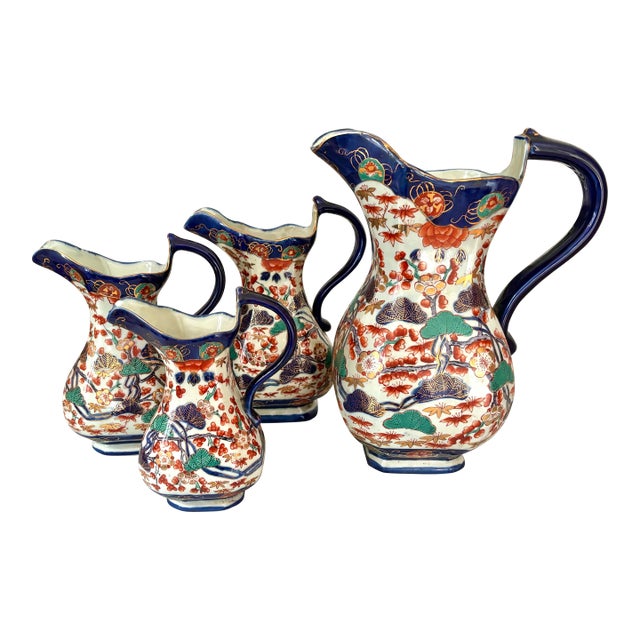 Complete set of 5 reproduction Victorian Imari style mason ironstone pitchers in rich orange, teal, and indigo and...