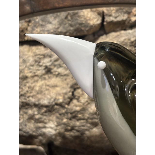 Hand-blown glass sculpture in smoky gray hues with an opaque finish, featuring pure lines and an organic shape. A design...