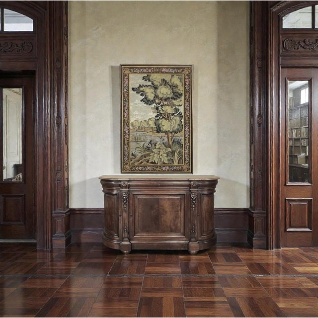 Inspired by the storied weaving traditions of Oudenaarde in Flanders, this antique wool tapestry presents a serene...