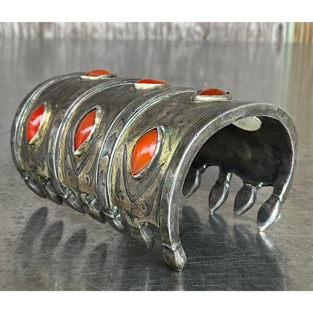 This vintage Turkoman cuff is hand-forged from gilt silver, its domed, architectural form rising into three ridged bands...