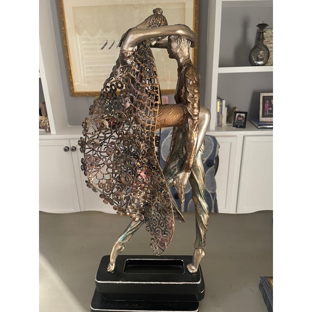 This is a beautiful sculpture we had in a large dining room. We have downsized and it needs a new home.