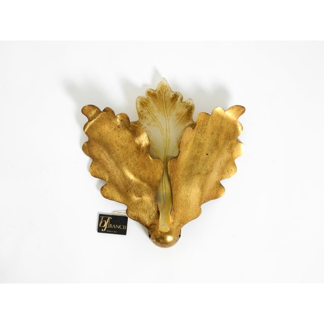 A beautiful, large, and rare wall lamp made of glass and gilded metal. manufactured by banci firenze in 2009. Made in...