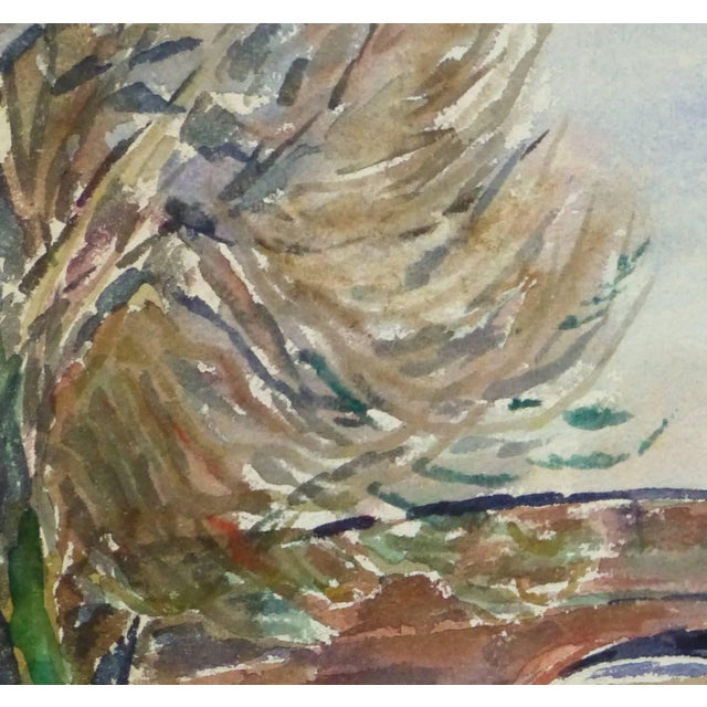 Charming watercolor landscape of an old stone bridge spanning a small reflective creek by Tae, circa 1960. Original one-...