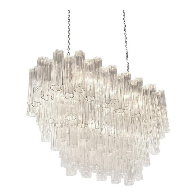 Scenographic italian hand-made chandelier with clear “tronchi”, elements of murano glass. huge chandelier in a bath of...