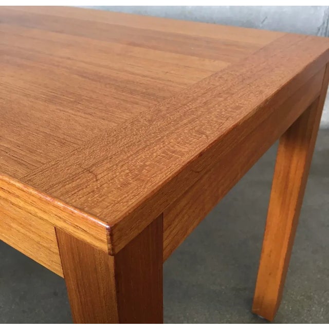 This teak side table is a case of simplicity and clean lines. Stamped underneath and in very good condition. Made of teak...