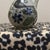 Add a touch of rustic charm and cultural artistry to your space with this beautiful Mexican pottery bud vase. Featuring a...