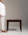 Walnut side table in Rich Walnut Brown. The rich walnut brown surface highlights clean tapered legs, simple rectangular...