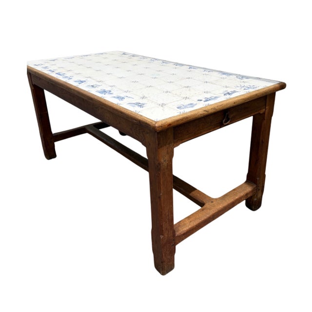 French or Dutch rustic farm table with absolutely charming Delft tile top and drawers on each end. Sturdy oak table...
