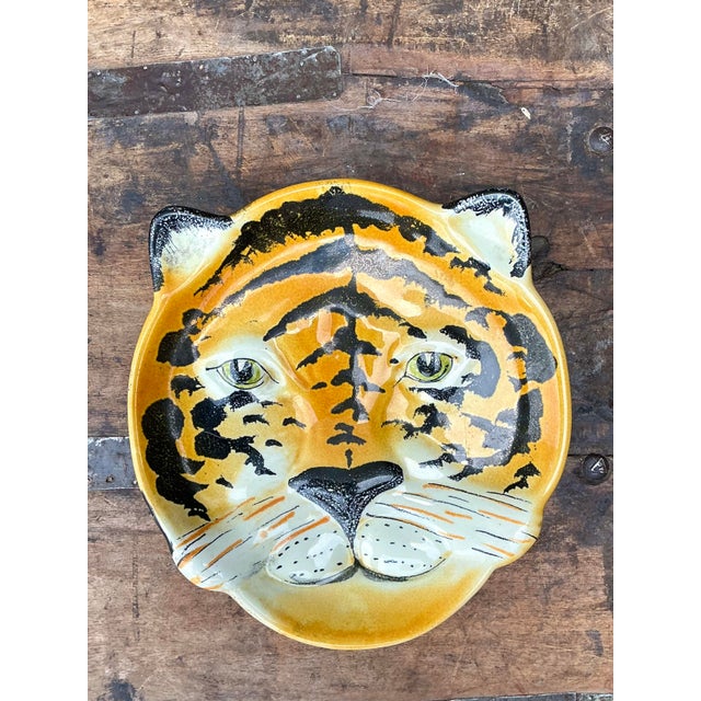 Unleash a touch of exotic whimsy with this captivating vintage tiger head plate, a quintessential example of mid-century...