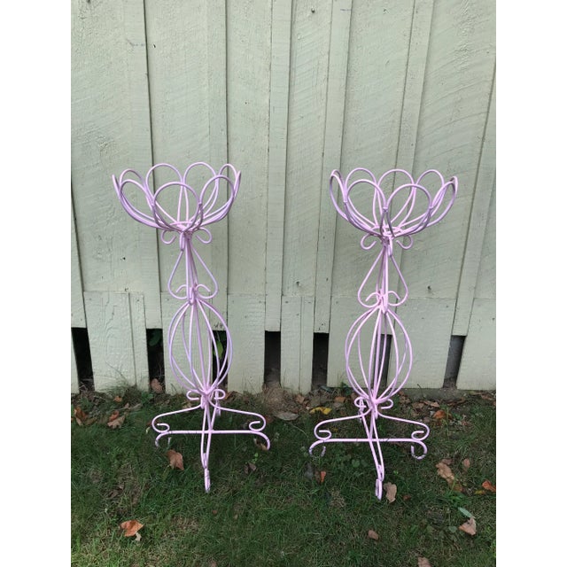 These are newly painted metal wire plant stands. Perfect for indoor of out. Painted cotton candy pink! These are very...