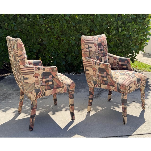 A striking pair of postmodern Parsons armchairs featuring a tall, sculptural silhouette and distinctive Memphis-style...