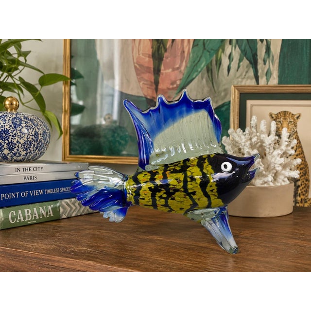 Add a striking burst of color and artistry to any interior with this beautifully handcrafted handblown art glass tropical...