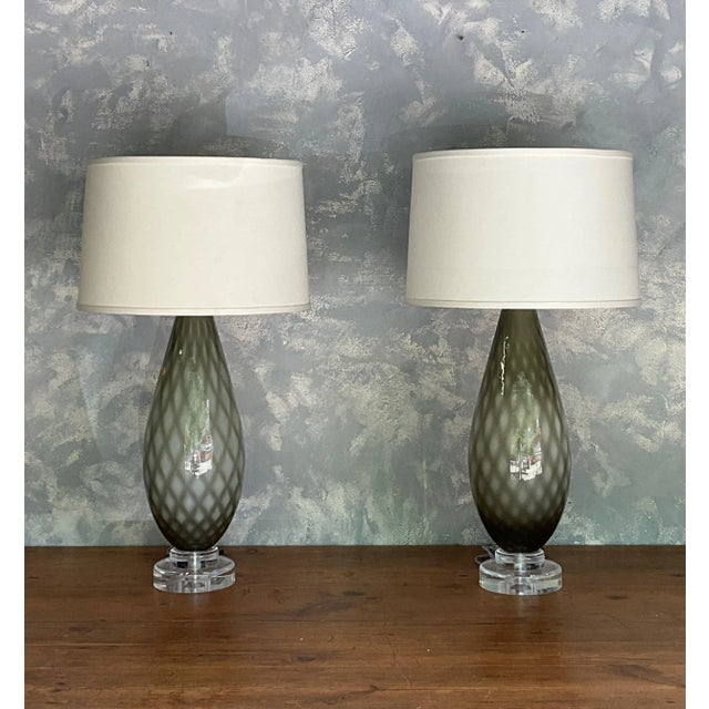 This handsome pair of Italian Murano glass table lamps from the 1950s is distinguished by a beautifully textured diamond...