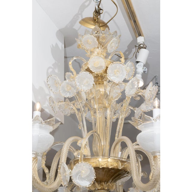 This is a lovely Murano chandelier with the clear mouth-blown glass combined with gold, creating an elegant presentation....