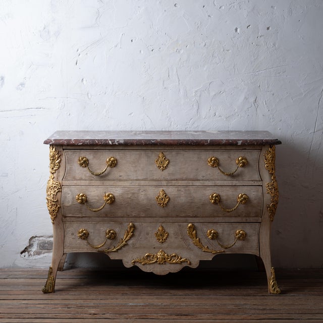 A bleached Louis XV style commode with marble top, mid-19th century. 55 inches wide by 22 inches deep by 36 inches tall...