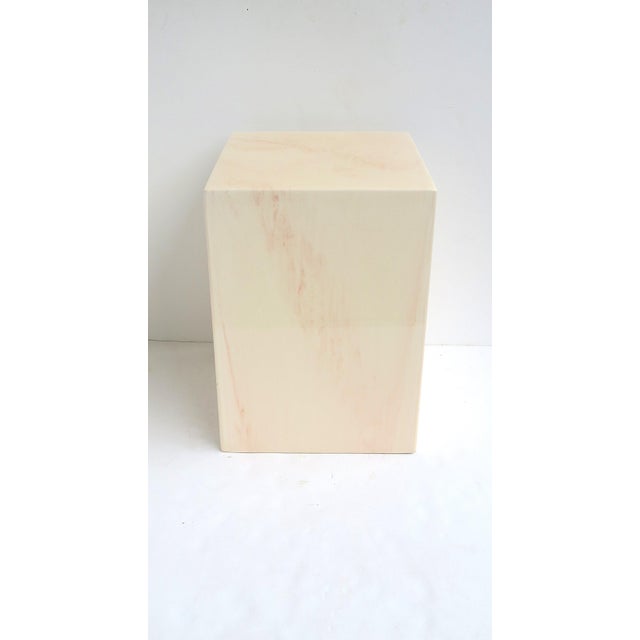 A substantial pedestal side table or pedestal end table, in the Modern style, circa late-20th century. Piece is a neutral...