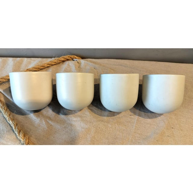 Set of 4 vintage Modern Minimalist ceramic wall planters. For plants or dry flowers. Each planter measures 4.5" high x...