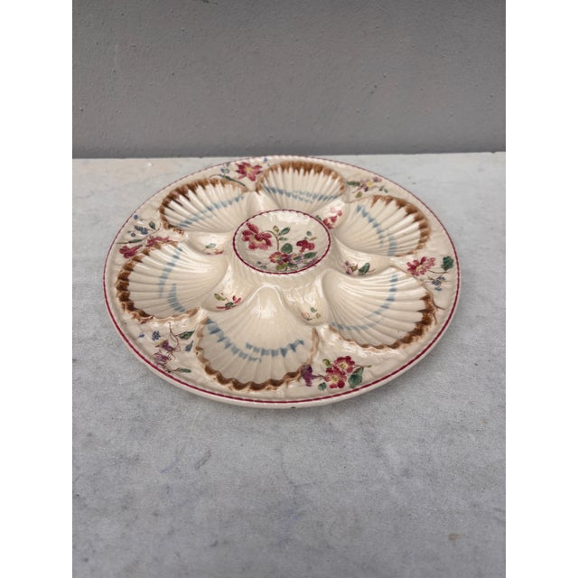 French Majolica oyster plate with flowers circa 1890 signed Longchamp.