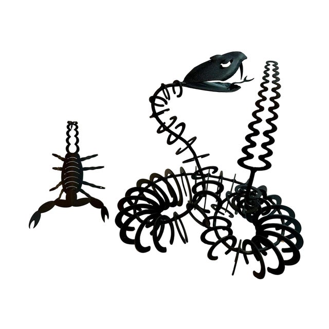 Sleek black iron modernist snake &amp; scorpion sculptures in a minimalist style. The snake’s sinuous form and the...