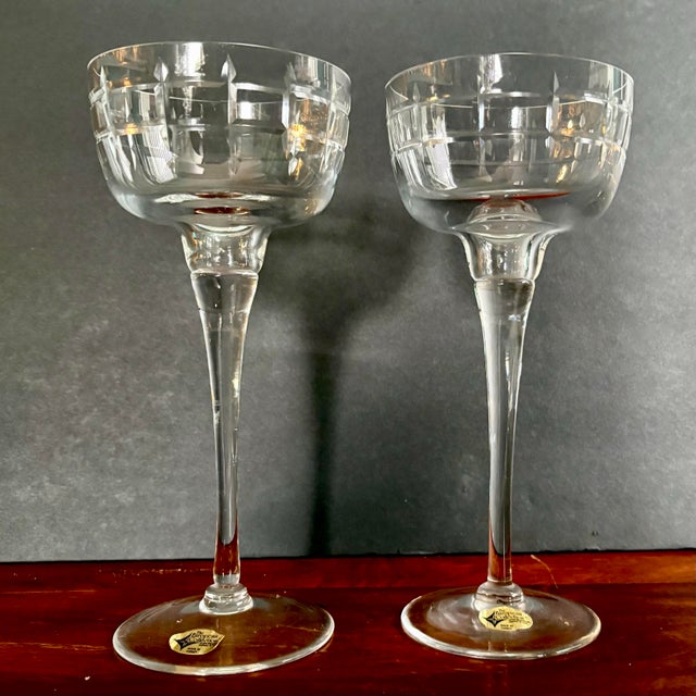Beautiful vintage set of two Prelude hand-cut Turkish crystal candleholders. These elegant pieces stand approximately 8...