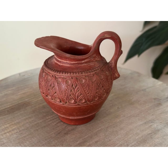 An authentic 19th-century Ottoman Empire terracotta creamer or small pitcher, hand-carved in the celebrated Tophane...