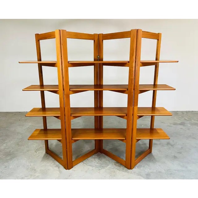 An elegant minimalist freestanding teak shelving unit that is versatile in design giving the option to place in the middle...