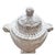 A substantial neoclassical style lidded urn featuring classical ram head handles, fluted body detailing, and an aged...