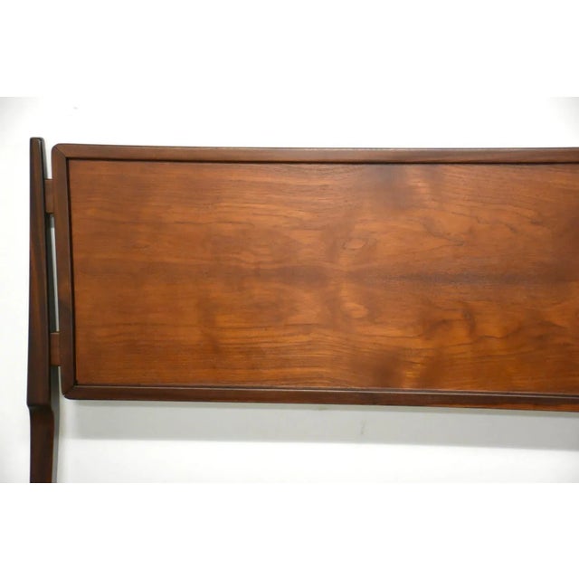 A king size mid century modern teak headboard designed by Kofod Larsen for Selig. Made in Denmark. Professionally...