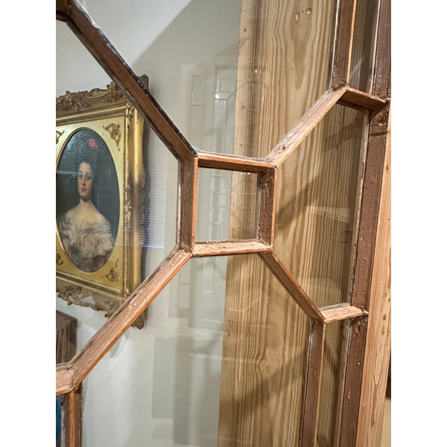 Monumental late 19th to early 20th century English library breakfront bookcase cabinet. Crafted from pine and made in the...