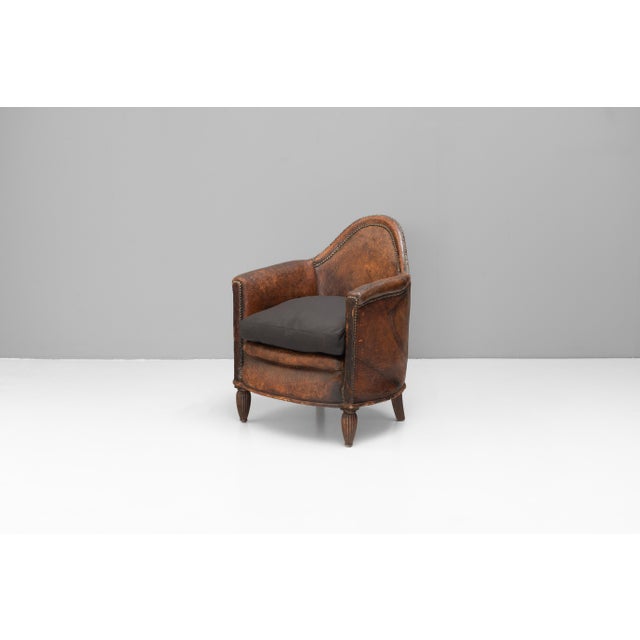 French tub chair in original leather upholstery. New cushion. Circa 1930.